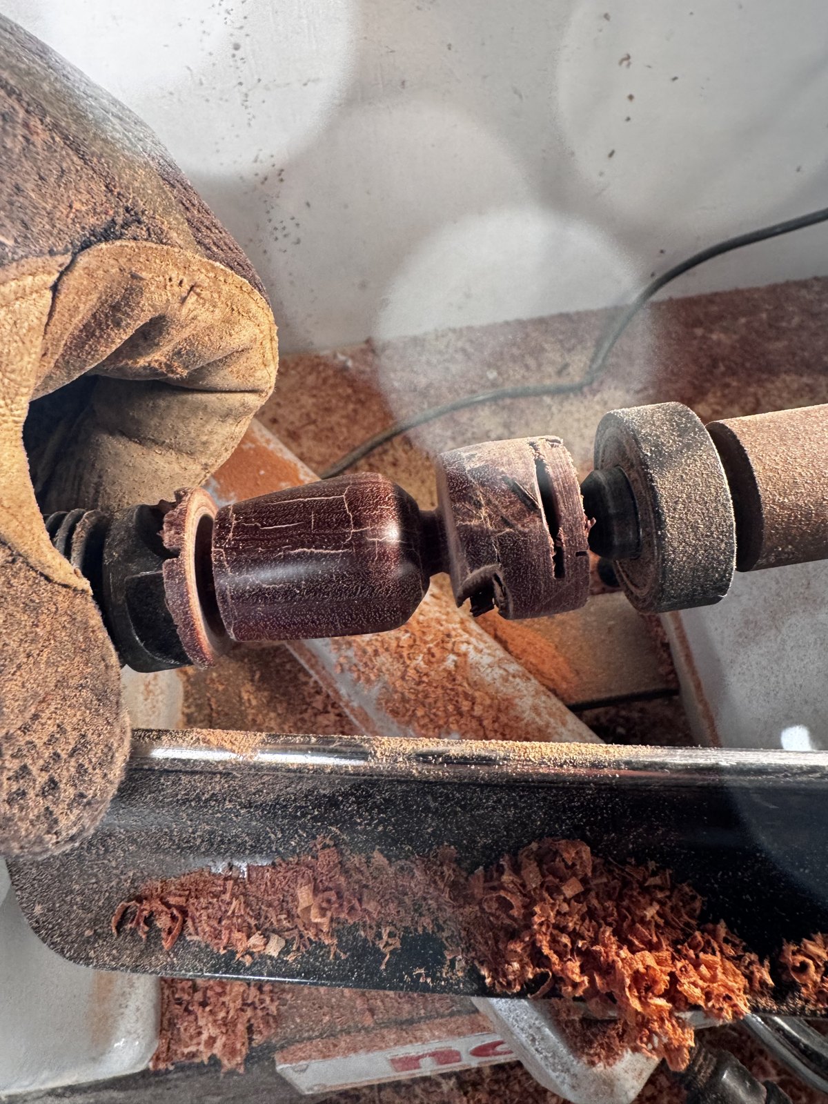 A piece being turned by hand
